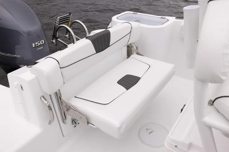 Slide: The Image of 2023 Wellcraft 222 Fisherman boat with white seating and Yamaha 150 engine. - 17