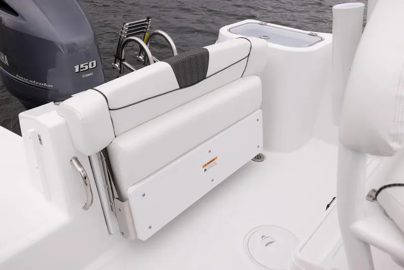 Slide: The Image of 2023 Wellcraft 222 Fisherman boat interior with foldable seat and Yamaha 150 engine. - 18