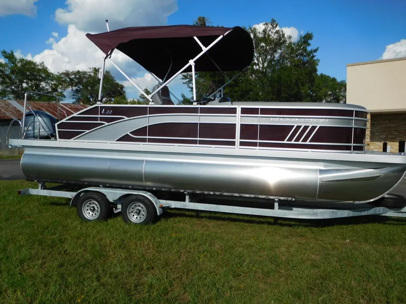 Slide: The Image of 2023 Bennington 22 LSB pontoon boat on a trailer, side view. - 0