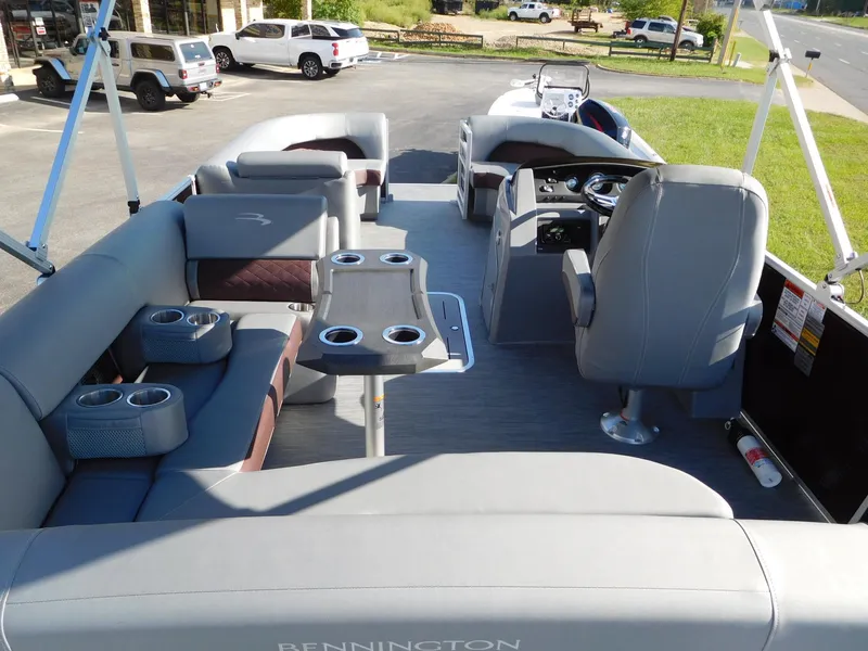 Slide: The Image of 2023 Bennington 22 LSB pontoon boat interior with seating and helm station. - 7