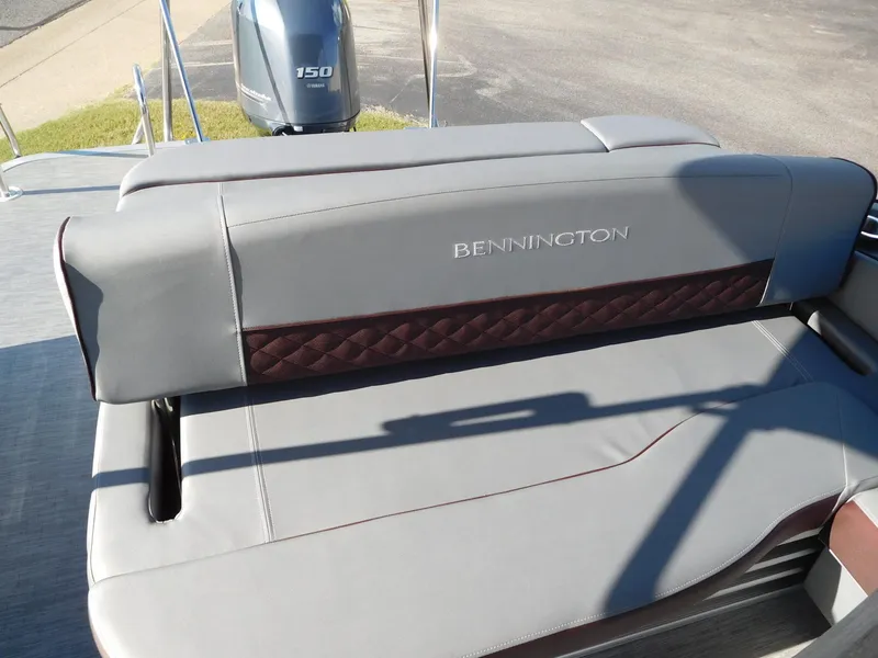 Slide: The Image of 2023 Bennington 22 LSB boat with gray and maroon seating and Yamaha 150 engine. - 8