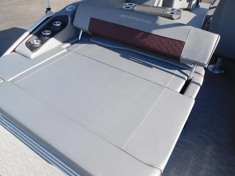 Slide: The Image of 2023 Bennington 22 LSB boat with luxurious seating and cup holders. - 9