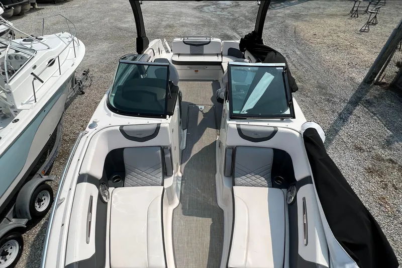 Slide: The Image of 2019 Chaparral 277 SSX boat interior with dual seating and open deck layout. - 6
