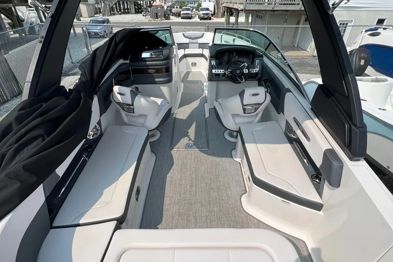 Slide: The Image of 2019 Chaparral 277 SSX boat interior with modern seating and sleek design. - 8