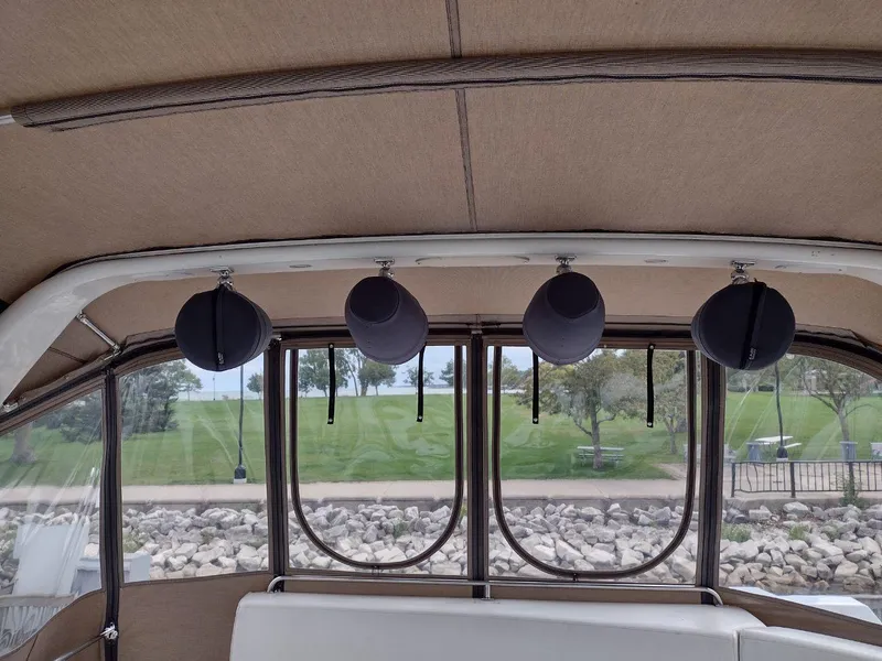 Slide: The Image of Interior view of 1999 Carver 530 Voyager Pilothouse with hanging speakers. - 18