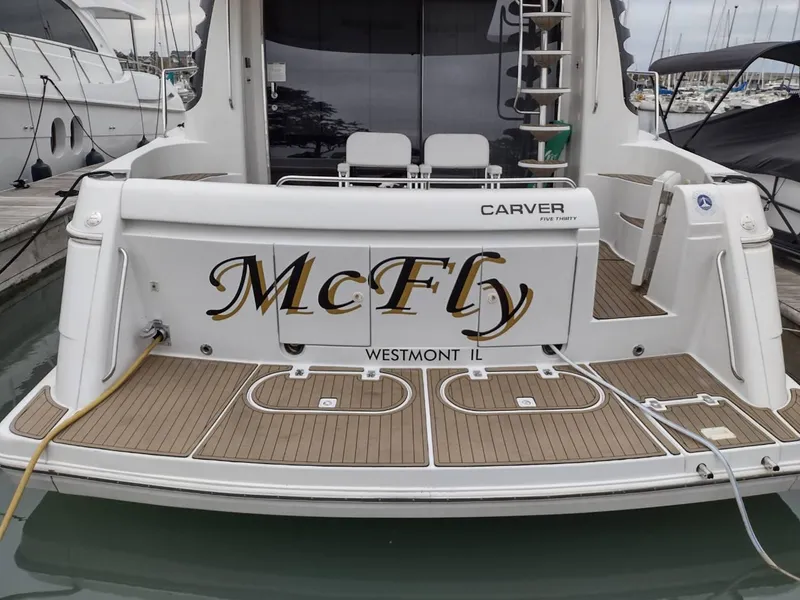Slide: The Image of 1999 Carver 530 Voyager Pilothouse yacht named McFly docked at marina. - 2