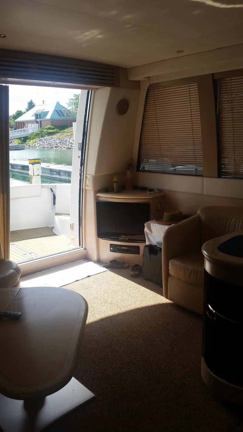 Slide: The Image of Interior of 1999 Carver 530 Voyager Pilothouse yacht with open door to deck. - 24