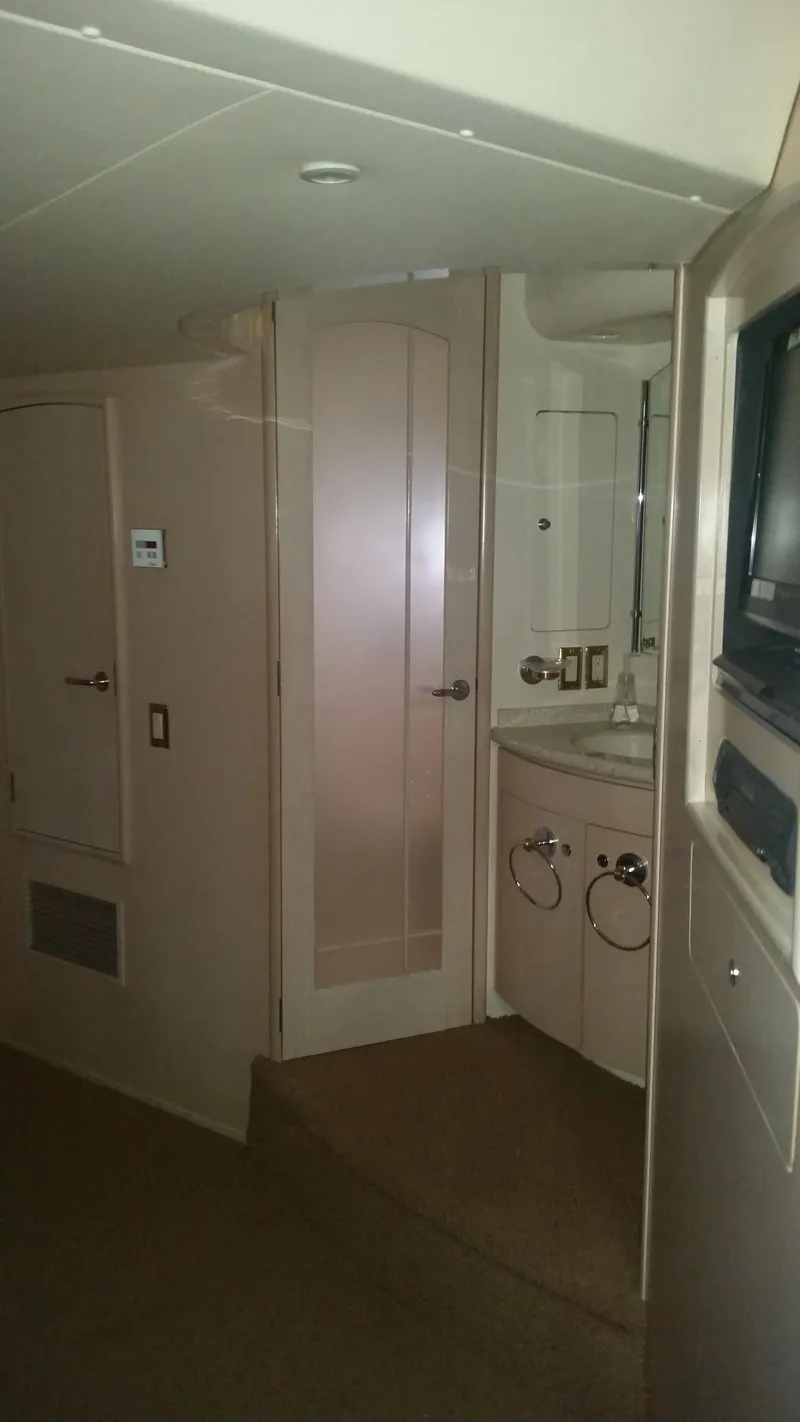 Slide: The Image of Interior of 1999 Carver 530 Voyager Pilothouse with bathroom and storage. - 29