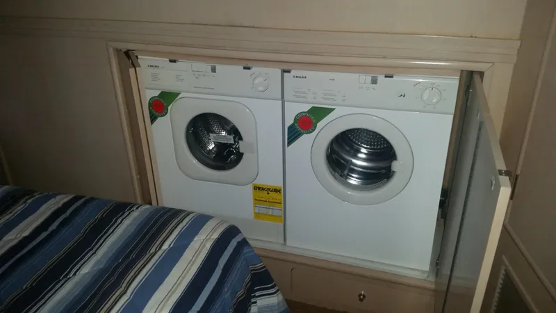 Slide: The Image of Built-in washer and dryer in 1999 Carver 530 Voyager Pilothouse yacht. - 31