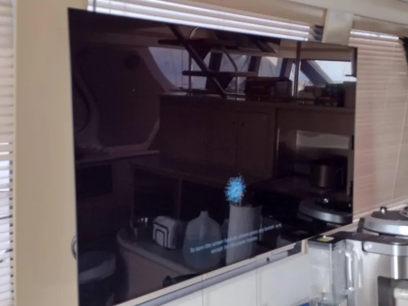 Slide: The Image of Flat-screen TV in the kitchen area of a 1999 Carver 530 Voyager Pilothouse yacht. - 14