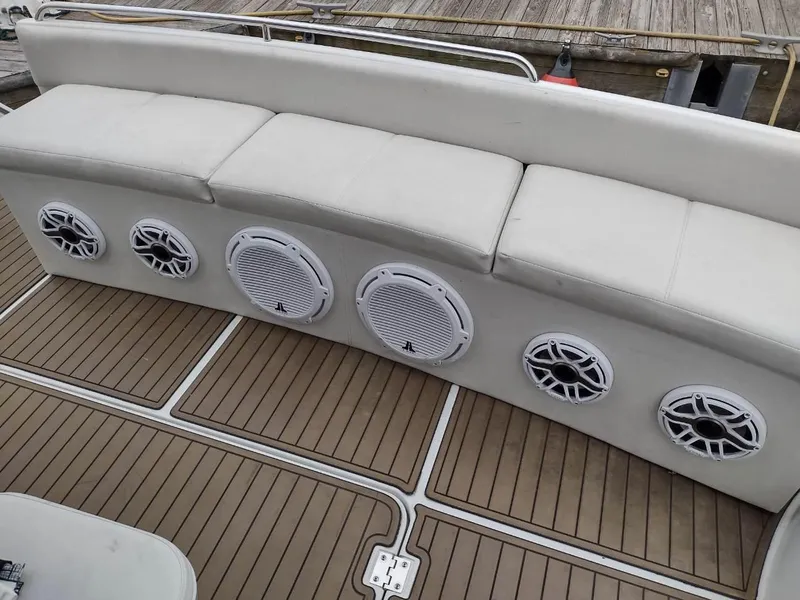 Slide: The Image of 1999 Carver 530 Voyager Pilothouse boat with cushioned seating and built-in speakers. - 16