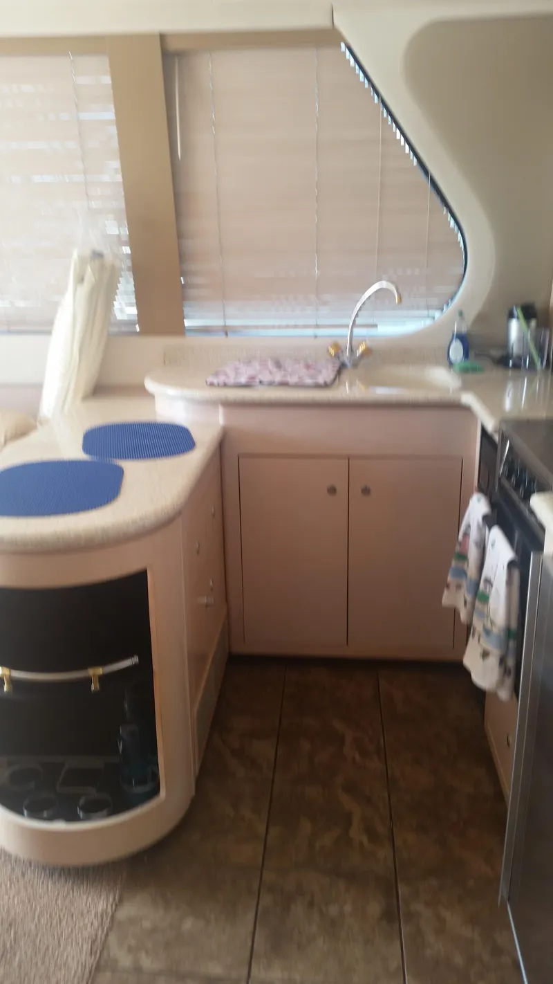 Slide: The Image of 1999 Carver 530 Voyager Pilothouse kitchen with modern amenities and stylish design. - 23