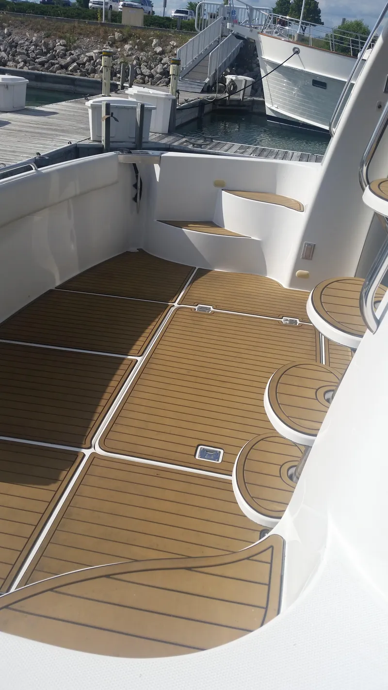 Slide: The Image of 1999 Carver 530 Voyager Pilothouse deck with teak flooring. - 3