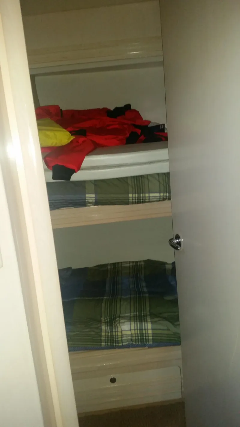 Slide: The Image of Bunk beds in the 1999 Carver 530 Voyager Pilothouse cabin. - 35