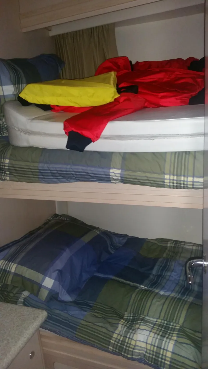 Slide: The Image of Bunk beds in the 1999 Carver 530 Voyager Pilothouse cabin. - 38