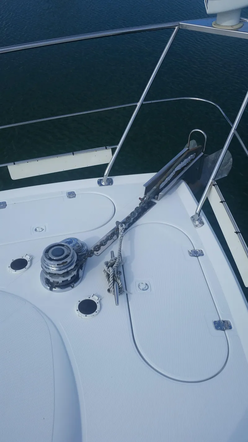 Slide: The Image of Anchor system on the deck of a 1999 Carver 530 Voyager Pilothouse yacht. - 40