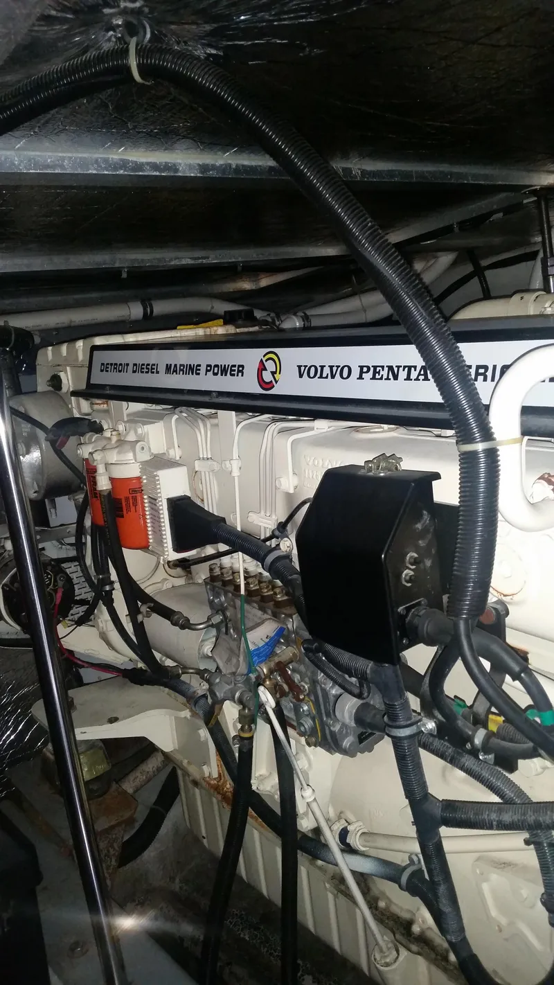 Slide: The Image of Engine room of a 1999 Carver 530 Voyager Pilothouse with Volvo Penta marine engine. - 46