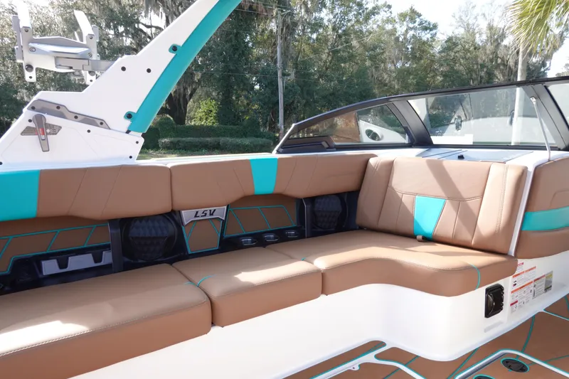 Slide: The Image of Interior of 2023 Malibu Wakesetter 23 LSV with brown and blue seating. - 11