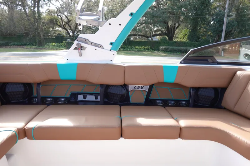 Slide: The Image of Interior of 2023 Malibu Wakesetter 23 LSV with brown seating. - 12