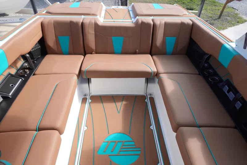 Slide: The Image of Interior of 2023 Malibu Wakesetter 23 LSV with brown and blue seating. - 13