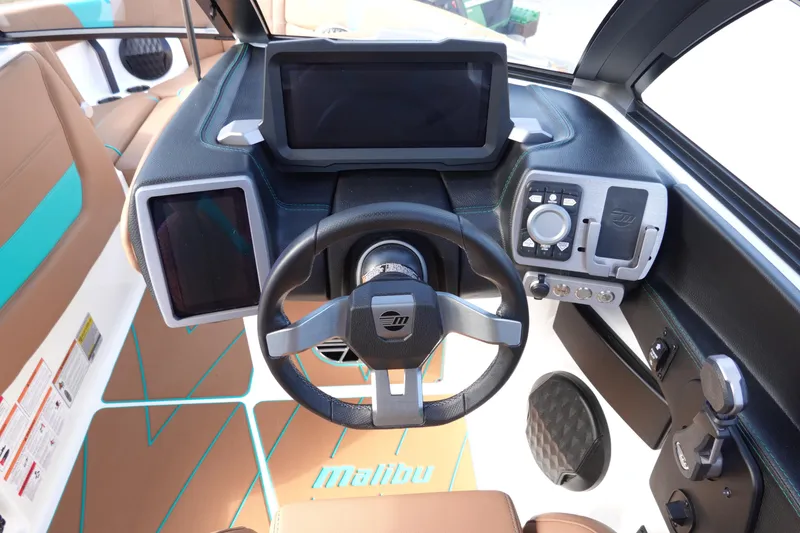 Slide: The Image of Interior view of 2023 Malibu Wakesetter 23 LSV cockpit with modern controls. - 17