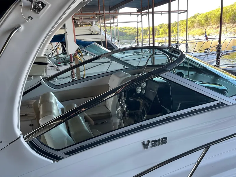 Slide: The Image of 2009 Four Winns V318 boat interior at a marina. - 11