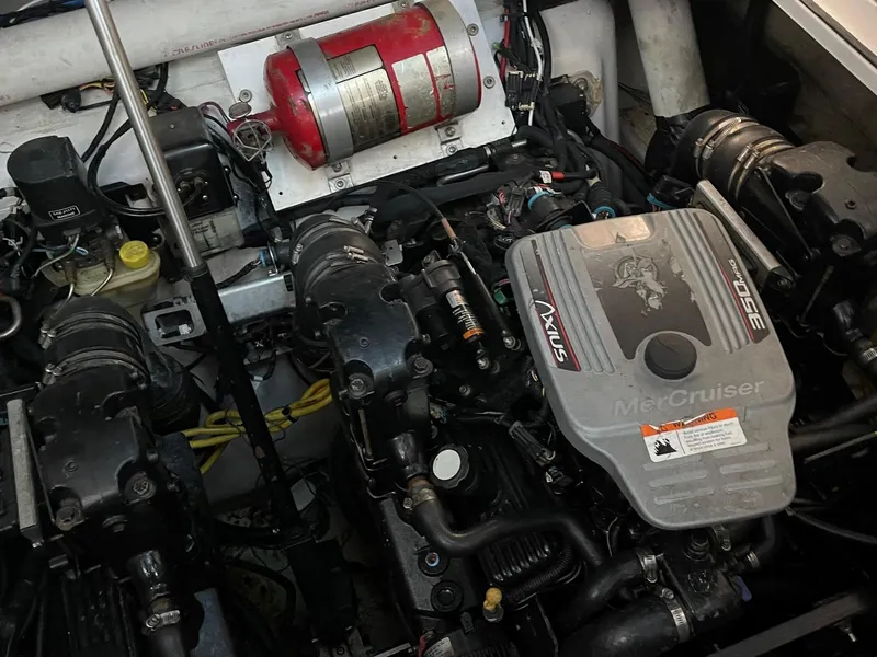 Slide: The Image of 2009 Four Winns V318 boat engine compartment with MerCruiser engine. - 27