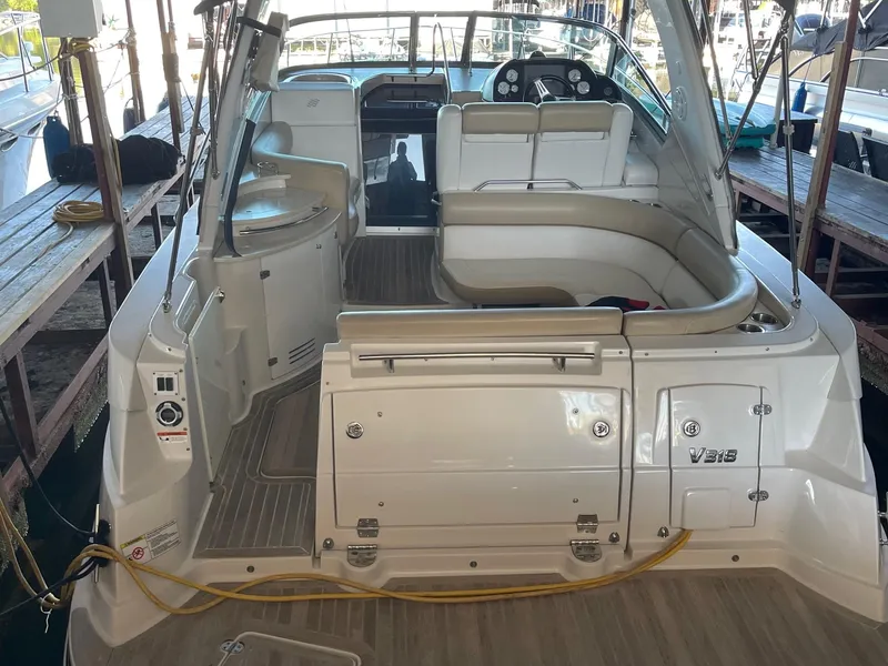 Slide: The Image of 2009 Four Winns V318 boat interior with seating and control panel. - 8