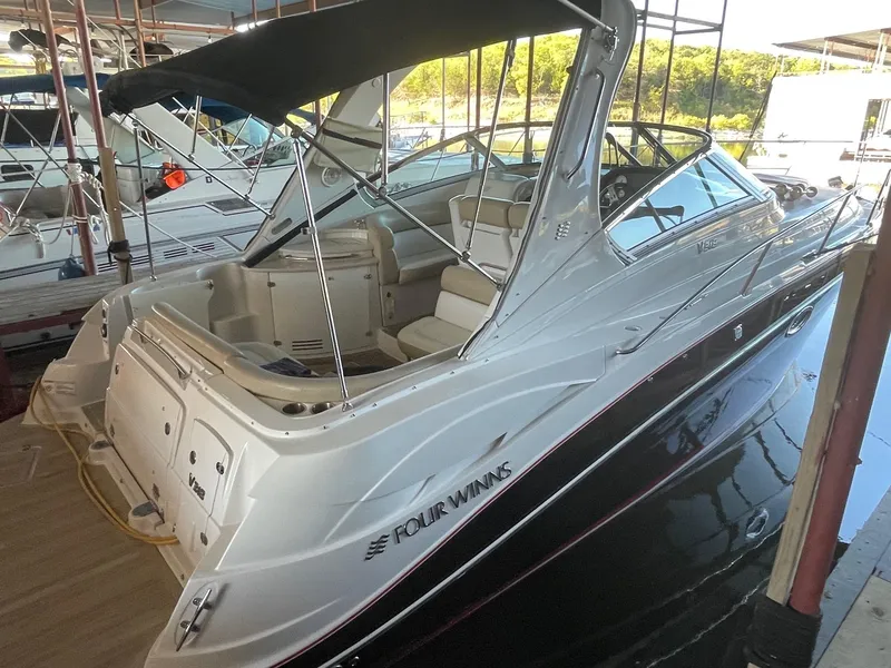 Slide: The Image of 2009 Four Winns V318 boat docked in a marina. - 9