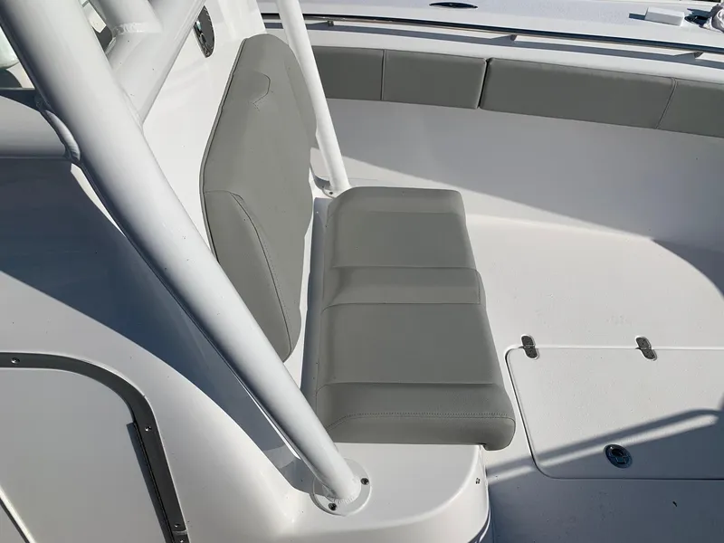 Slide: The Image of 2024 Cape Horn 31T boat with gray cushioned seating and white deck. - 13