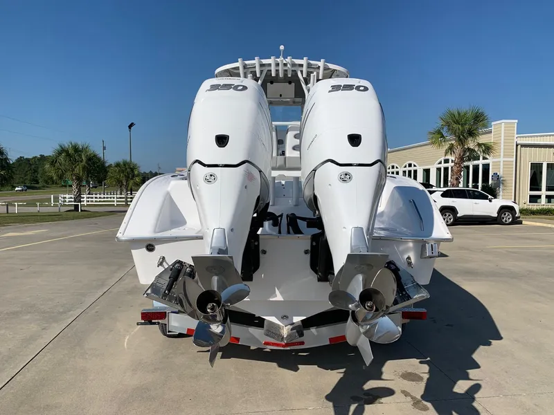 Slide: The Image of 2024 Cape Horn 31T boat with twin 350 horsepower engines, rear view. - 2