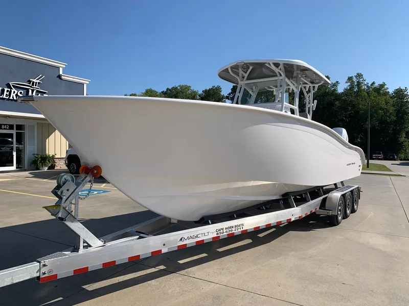 Slide: The Image of 2024 Cape Horn 31T boat on trailer outside dealership. - 4