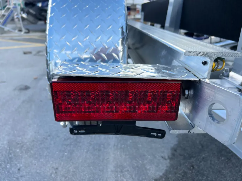 Slide: The Image of Close-up of a 2023 Trailer TRAILERS model with red tail light. - 16