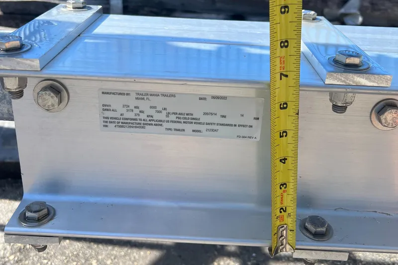Slide: The Image of Close-up of 2023 Trailer TRAILERS model with measurement tape. - 27