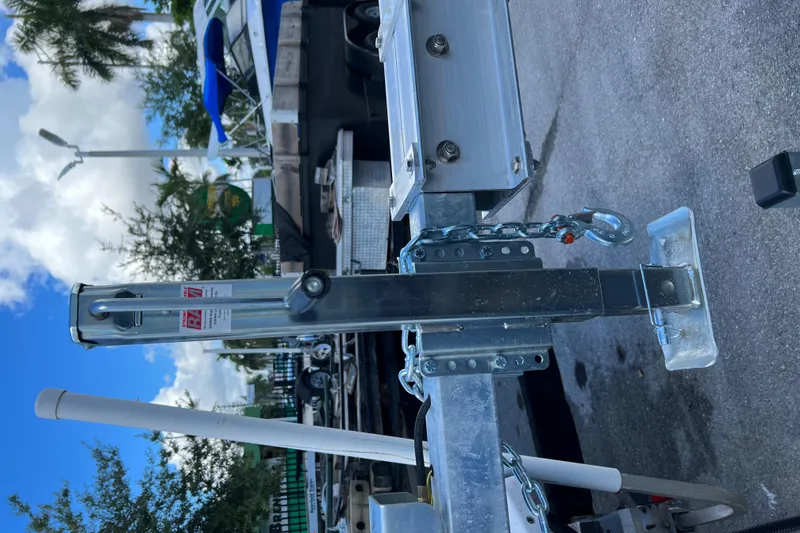 Slide: The Image of 2023 Trailer model TRAILERS hitch mechanism with safety chains and coupler. - 29