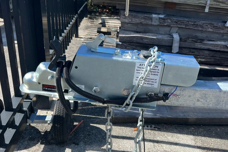 Slide: The Image of 2023 Trailer TRAILERS hitch with safety chains and wiring. - 32