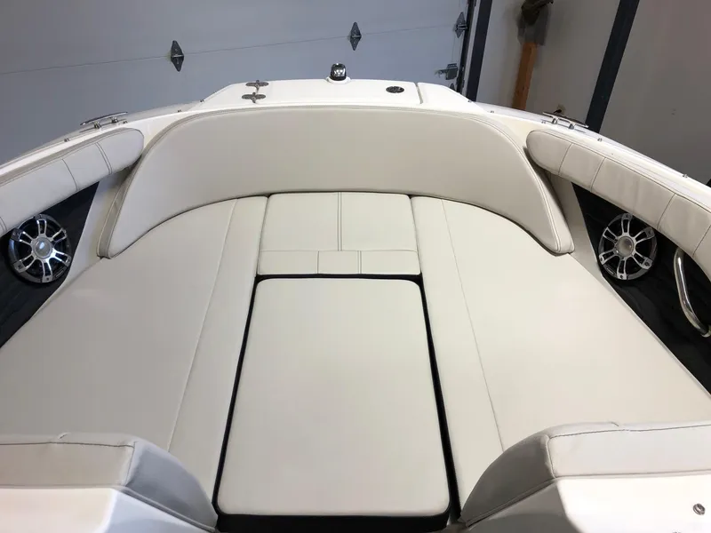 Slide: The Image of 2023 Sea Ray 190 SPO boat interior with white cushioned seating - 11