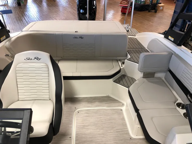 Slide: The Image of Interior of 2023 Sea Ray 190 SPO boat with white and black seating. - 12