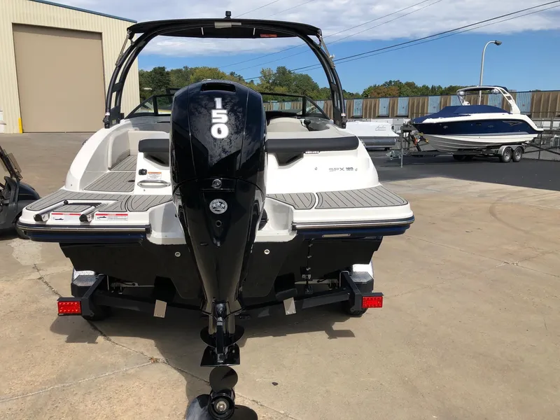 Slide: The Image of 2023 Sea Ray 190 SPO boat with 150 HP outboard motor, rear view. - 3