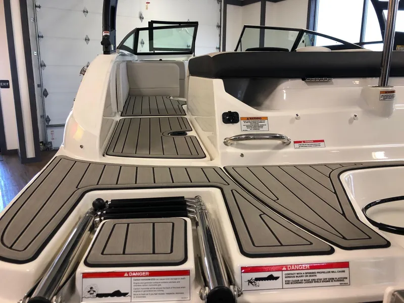 Slide: The Image of 2023 Sea Ray 190 SPO boat interior with non-slip deck and seating area. - 5