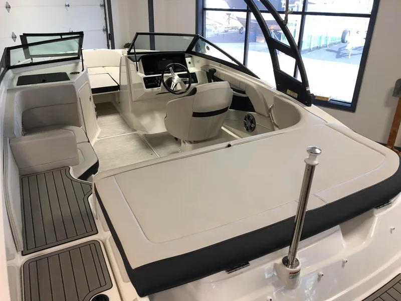 Slide: The Image of 2023 Sea Ray 190 SPO boat interior with seating and steering wheel. - 6