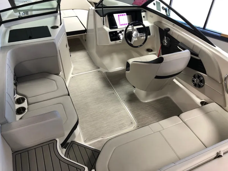 Slide: The Image of 2023 Sea Ray 190 SPO boat interior with modern seating and steering console. - 7