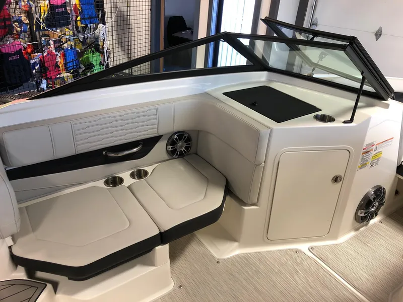 Slide: The Image of 2023 Sea Ray 190 SPO boat interior with seating and storage. - 8
