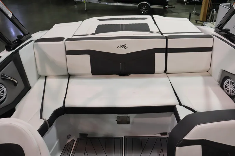 Slide: The Image of 2023 Monterey 238 Super Sport boat interior with white and black seating. - 12