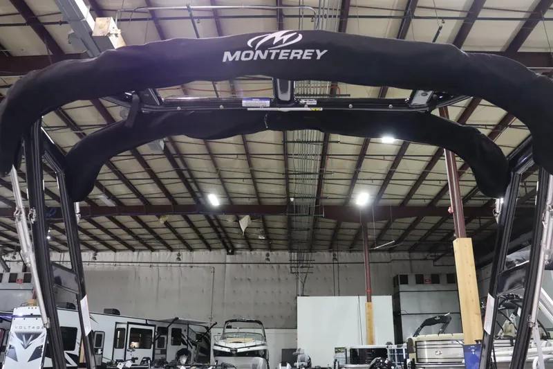 Slide: The Image of 2023 Monterey 238 Super Sport boat in a warehouse. - 13