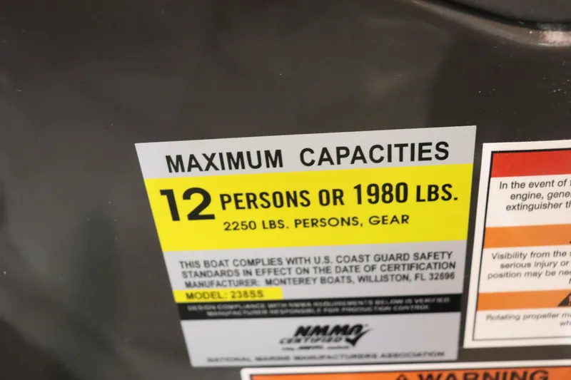 Slide: The Image of 2023 Monterey 238 Super Sport capacity label: 12 persons or 1980 lbs, 2250 lbs with gear. - 14