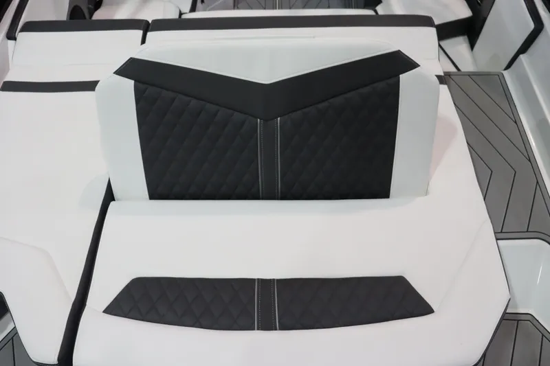 Slide: The Image of 2023 Monterey 238 Super Sport boat interior with black and white quilted seats. - 15