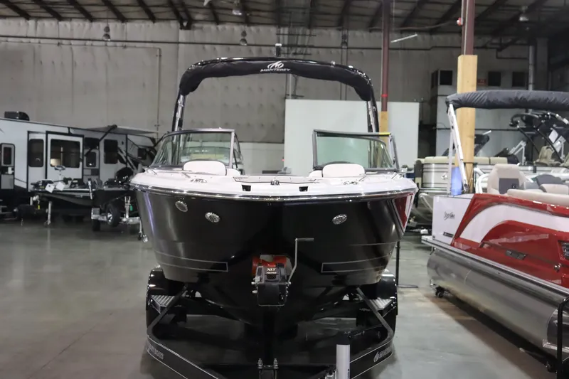 Slide: The Image of 2023 Monterey 238 Super Sport boat in showroom. - 2
