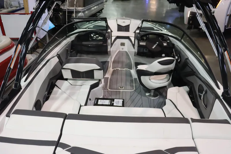 Slide: The Image of 2023 Monterey 238 Super Sport boat interior with white and black seating. - 5