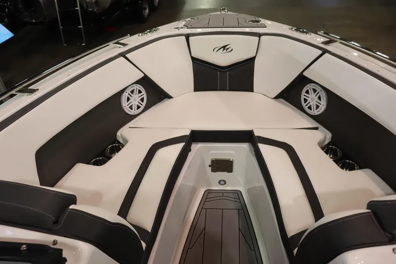 Slide: The Image of 2023 Monterey 238 Super Sport boat interior with white and black seating. - 6